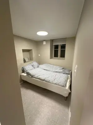 a bedroom with a bed in a small room at Sparresgaten 2 in Bergen
