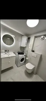 a small bathroom with a toilet and a sink at Sparresgaten 2 in Bergen
