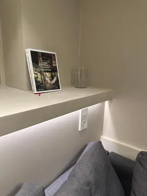 a book sitting on a shelf in a room at Sparresgaten 2 in Bergen