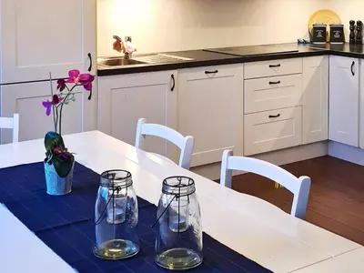 a kitchen with a table with two glass jars on it at 8 person holiday home in Masfjordnes-By Traum in Masfjorden