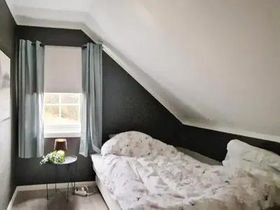 a bedroom with a bed and a window at 8 person holiday home in Masfjordnes-By Traum in Masfjorden
