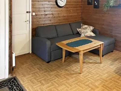 a living room with a couch and a coffee table at 3 person holiday home in Flatraket-By Traum in Barmen
