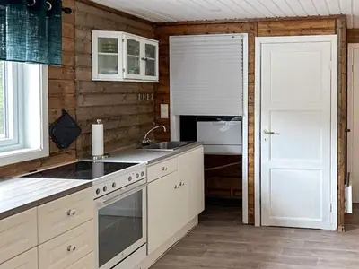 a kitchen with a sink and a stove at 3 person holiday home in Flatraket-By Traum in Barmen
