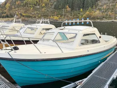 three boats docked at a dock in the water at 3 person holiday home in Flatraket-By Traum in Barmen