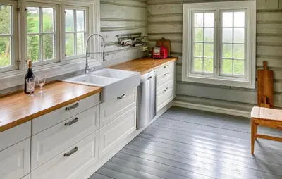a kitchen with white cabinets and a sink and windows at Gorgeous Home In Svatsum With Wifi in Svingvoll