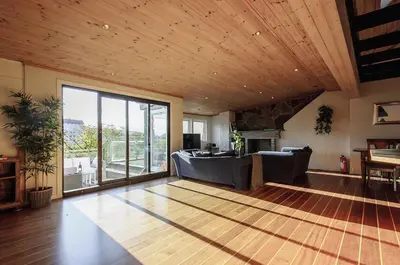 a living room with a wooden ceiling at The View - BIG Apartment in City Center in Bergen