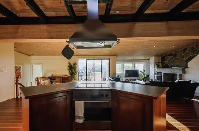 a kitchen with a stove top oven in a room at The View - BIG Apartment in City Center in Bergen