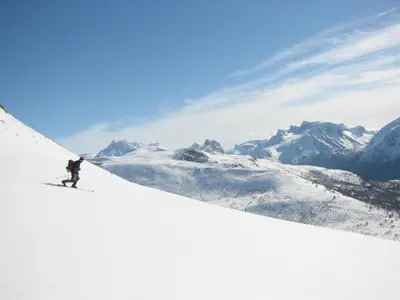 a person is skiing down a snow covered mountain at Bakkebo Rampestreken in Åndalsnes