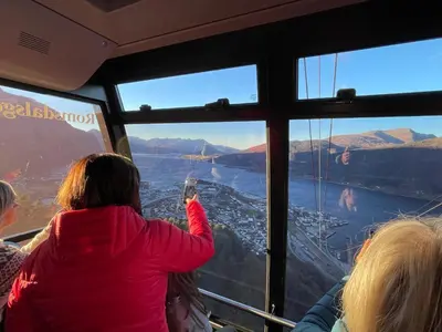 a group of people looking out the window of a bus at Bakkebo Rampestreken in Åndalsnes
