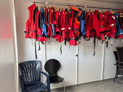 a bunch of red and blue umbrellas hanging on a rack at 8 person holiday home in Flatraket-By Traum in Barmen