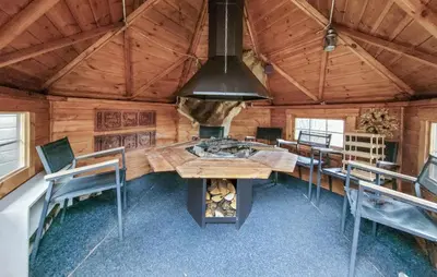 a dining room with a table and chairs in a cabin at Nice Home In Jelsa With Kitchen in Jelsa