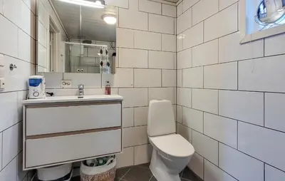 a white bathroom with a sink and a toilet at Nice Home In Jelsa With Kitchen in Jelsa