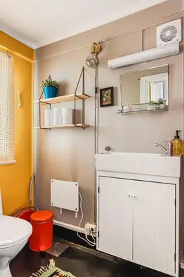 a bathroom with a white sink and a toilet at Dinbnb Apartments I Family Dream in Bergen I Playroom I Private Garden in Bergen