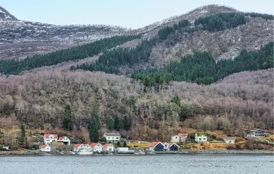 a small town on the shore of a body of water at 4 Bedroom Awesome Home In Nedre Vats in Stokka