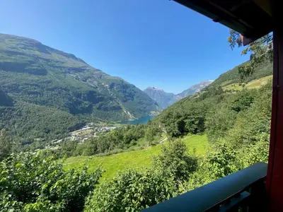a view of a valley in the mountains at Hole Hytter in Geiranger
