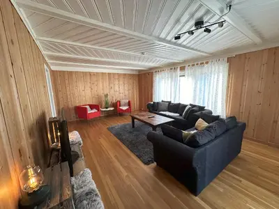 a living room with a couch and a table at Stort hus sentralt i Lillehammer in Lillehammer