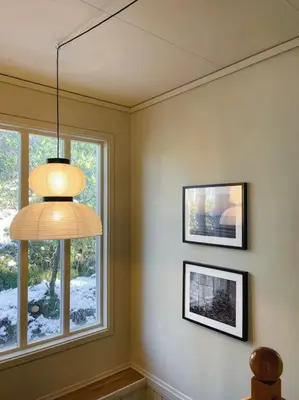 a room with a chandelier and two windows at Spacious villa with view - 5BR - FREE parking - Great Wi-Fi in Bergen