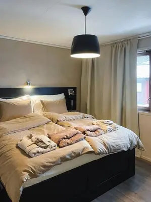 a bedroom with a large bed with blankets on it at Spacious villa with view - 5BR - FREE parking - Great Wi-Fi in Bergen
