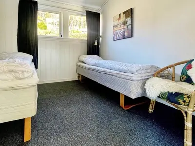 a room with two beds and a window at 6 person holiday home in Dalsøyra-By Traum in Dalsøyra