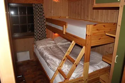 a bunk bed in a room with a bunk bed in a cabin at Trevet by Norgesbooking - cabin close to skicenter in Ål
