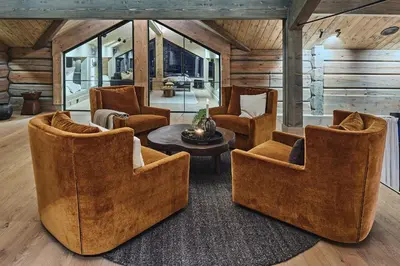 a living room with three chairs and a table at Chalet Strandafjellet in Stranda