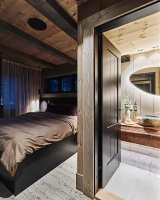 a bedroom with a bed and a tub in it at Chalet Strandafjellet in Stranda