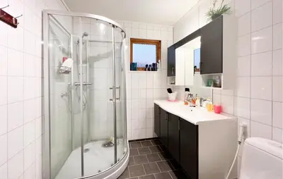 a bathroom with a shower and a sink at 4 Bedroom Beautiful Home In Sekken in Molde
