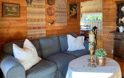 a living room with a couch and a table at 2 Bedroom Cozy Home In Skodje in Skodje