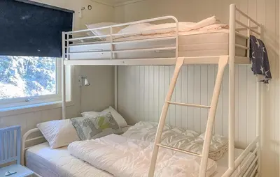 a bunk bed in a small room with a bunk bedutenewayewayangering at 2 Bedroom Lovely Home In Raudeberg in Raudeberg