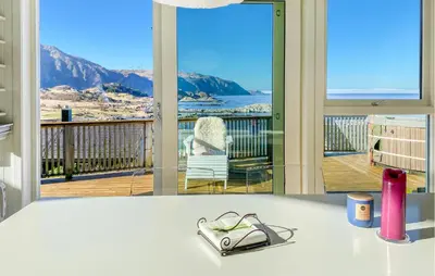 a counter top with a view of a balcony at 2 Bedroom Lovely Home In Raudeberg in Raudeberg