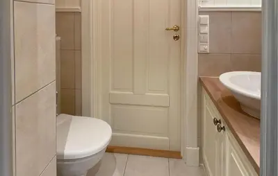 a bathroom with a white toilet and a sink at Amazing Home In Eiksund With Kitchen in Eiksund