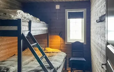 a bedroom with a bunk bed and a window at Stunning Home In Eggedal With Wifi in Eggedal