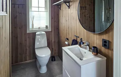 a bathroom with a toilet and a sink and a mirror at Stunning Home In Eggedal With Wifi in Eggedal