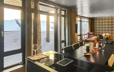 a living room with a table with wine glasses at Amazing Apartment In Noresund With Wifi in Noresund