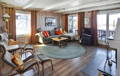 a living room with a couch and a table at Gorgeous Home In Rjukan With Kitchen in Rjukan