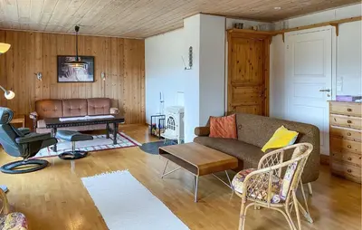 a living room with a couch and a table at Stunning Apartment In Eidsvåg I Romsdal in Toven