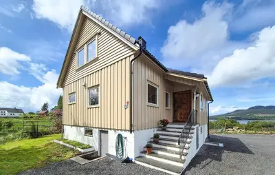 a tiny house with stairs and a porch at Amazing Home In Vikebygd With Wifi in Vikebygd