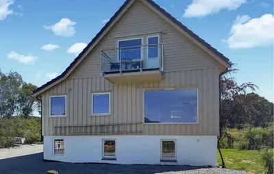 a house with a balcony on top of it at Amazing Home In Vikebygd With Wifi in Vikebygd