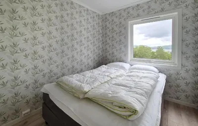 a bedroom with a bed and a window at Amazing Home In Vikebygd With Wifi in Vikebygd