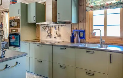a kitchen with white cabinets and a sink at 4 Bedroom Gorgeous Home In Bjorli in Bjorli
