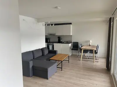 a living room with a couch and a table at Trolltun, Frystevegen 4 in Ulvik