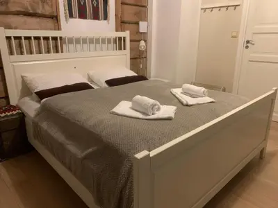 a bedroom with a bed with two towels on it at Stryn Golden Resort-«Skulehuset» in Stryn