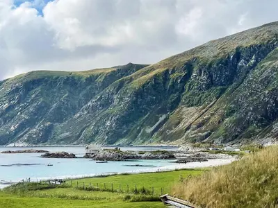 a view of a mountain with a body of water at 8 person holiday home in Bremanger in Grotle
