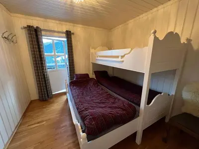 a small room with a bunk bed in a house at Leilighet i Uvdal med nydelig utsikt in Sønstebø