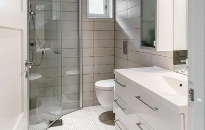 a bathroom with a shower and a toilet and a sink at Lovely Home In Valldal in Valldal