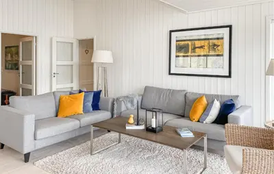 a living room with a couch and a coffee table at Lovely Home In Valldal in Valldal