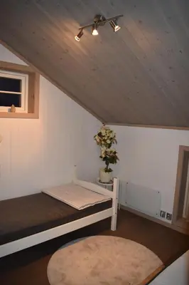 a room with two bunk beds in a house at A wonderful estate of two houses for all seasons! in Trysil