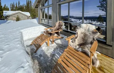 a dog sitting on a bench in the snow at Pet Friendly Home In Gålå With Kitchen in Gålå
