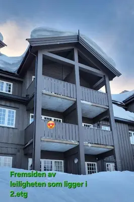 a building with a deck with a frisbee on it at Ski in Ski out Trysil in the mountain of Norway 60m from the Slopes in Trysil