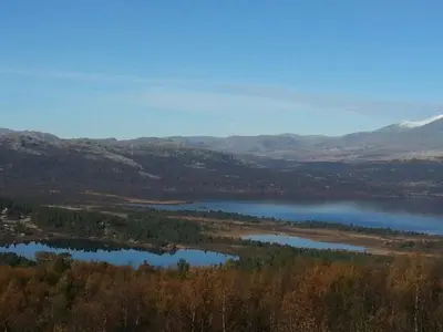 an aerial view of a lake in the mountains at Bjørgebu Camping AS in Mysusæter